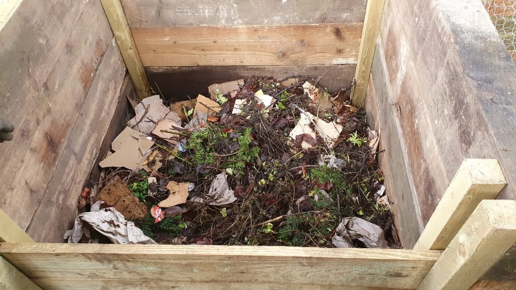 photo of what we put in a compost bin - garden waste, cardboard