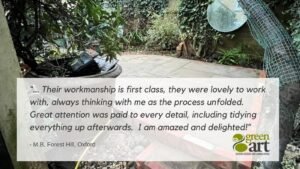 Image of small courtyard garden which was landscaped by GreenArt, testimonial over the image.