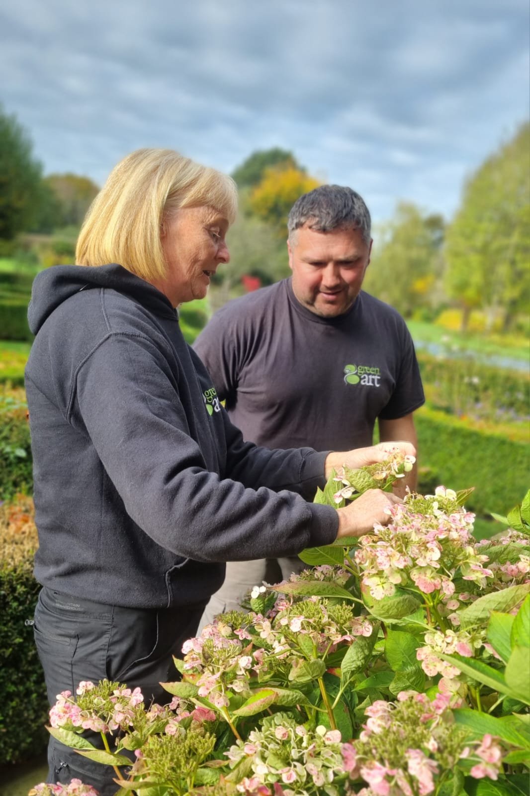 Sam and Danny doing gardening together.
